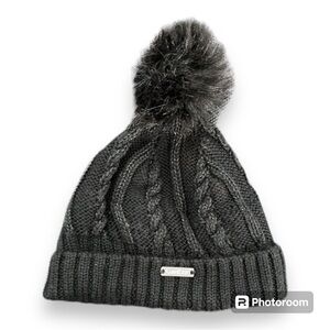 Black winter toque with faux fur pompom